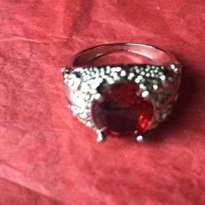 Silver tone ring with ruby style stone, size 9